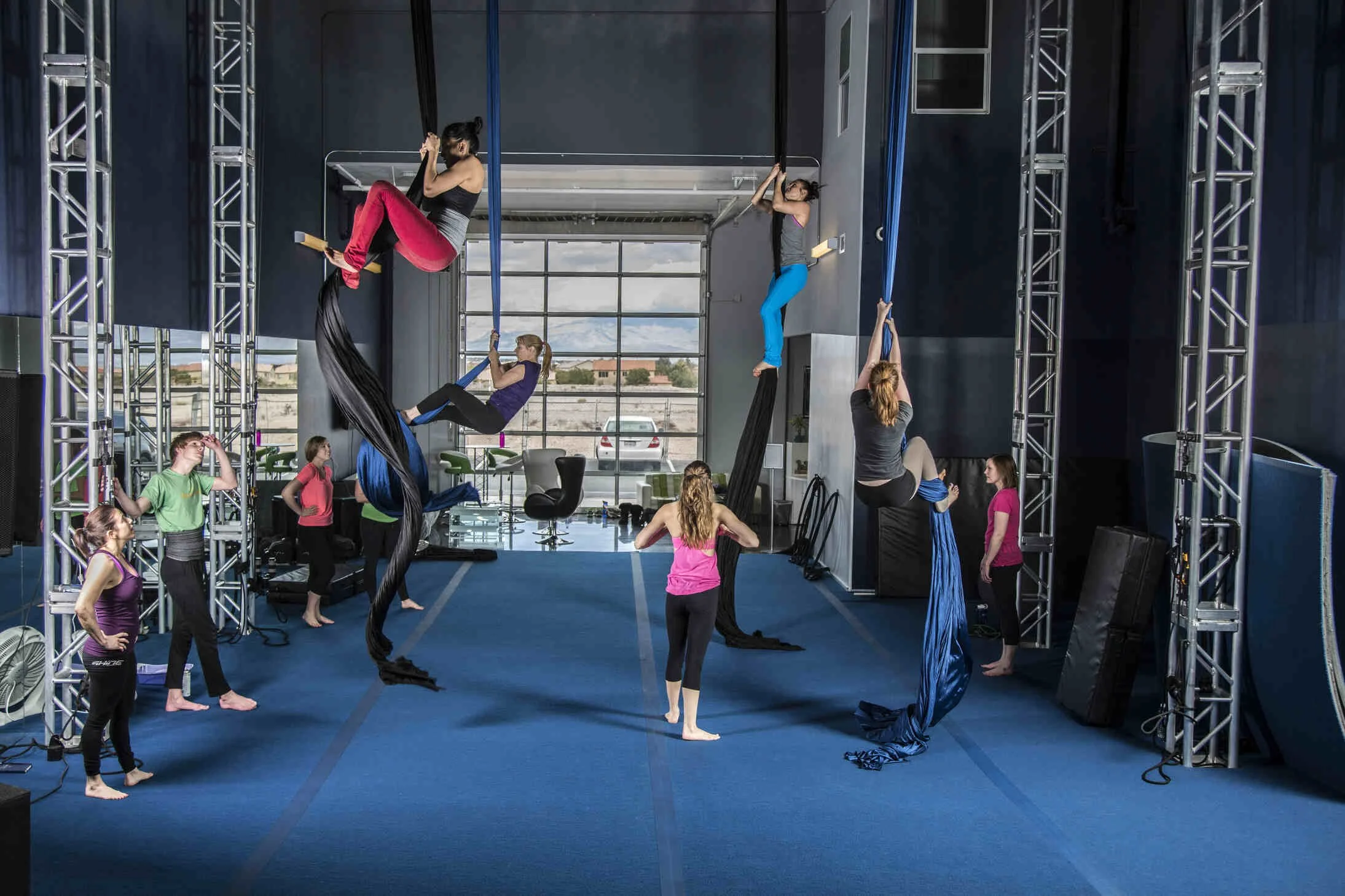 Aerial silks class at Shine Alternative Fitness in Las Vegas, illustrating training camp instruction