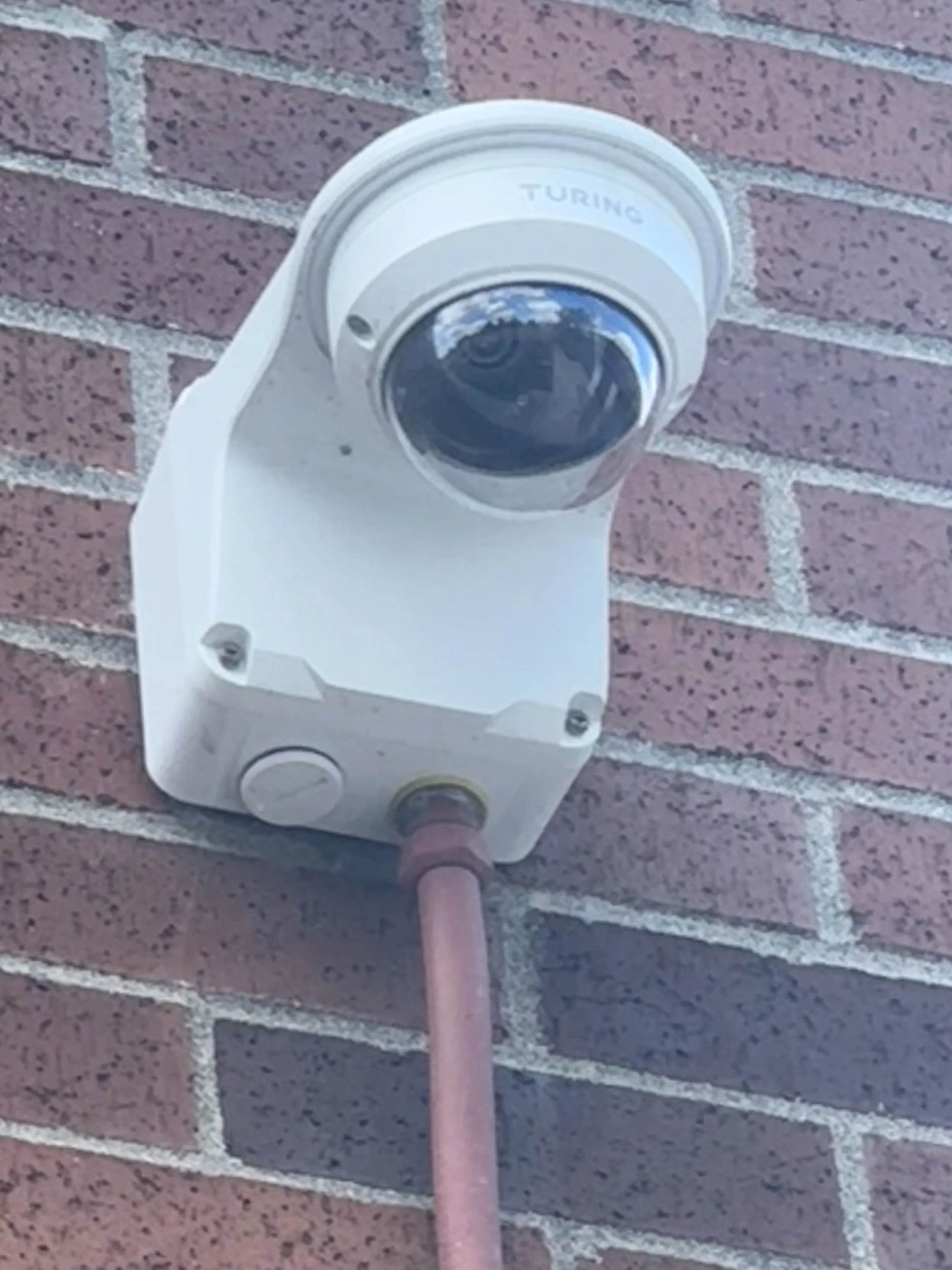 Camera mounted on brick