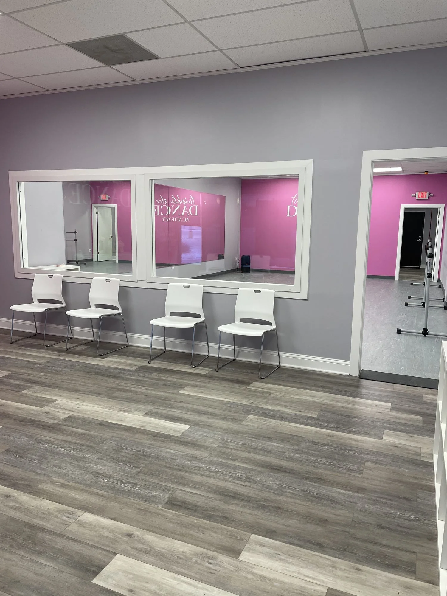 The parent lobby, with chairs facing viewing windows into the studio