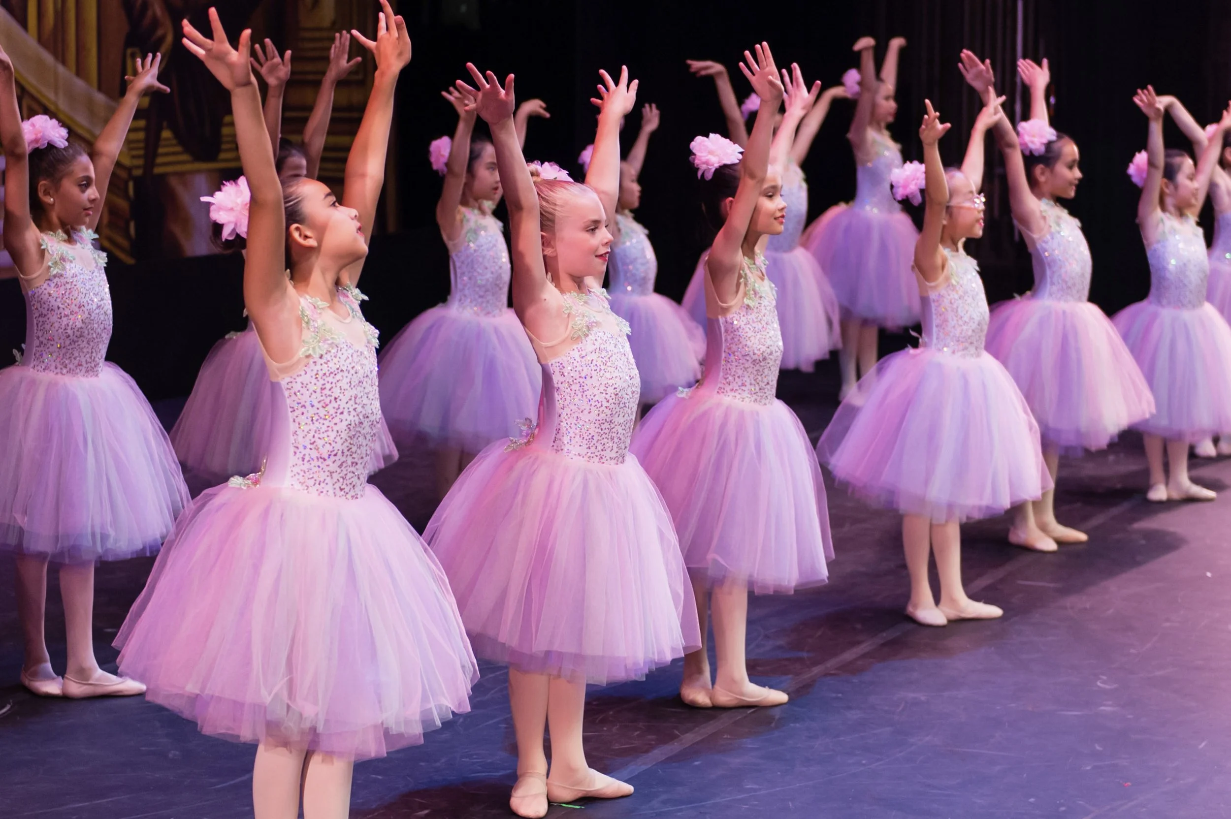 Young dancers performing in a recital setting