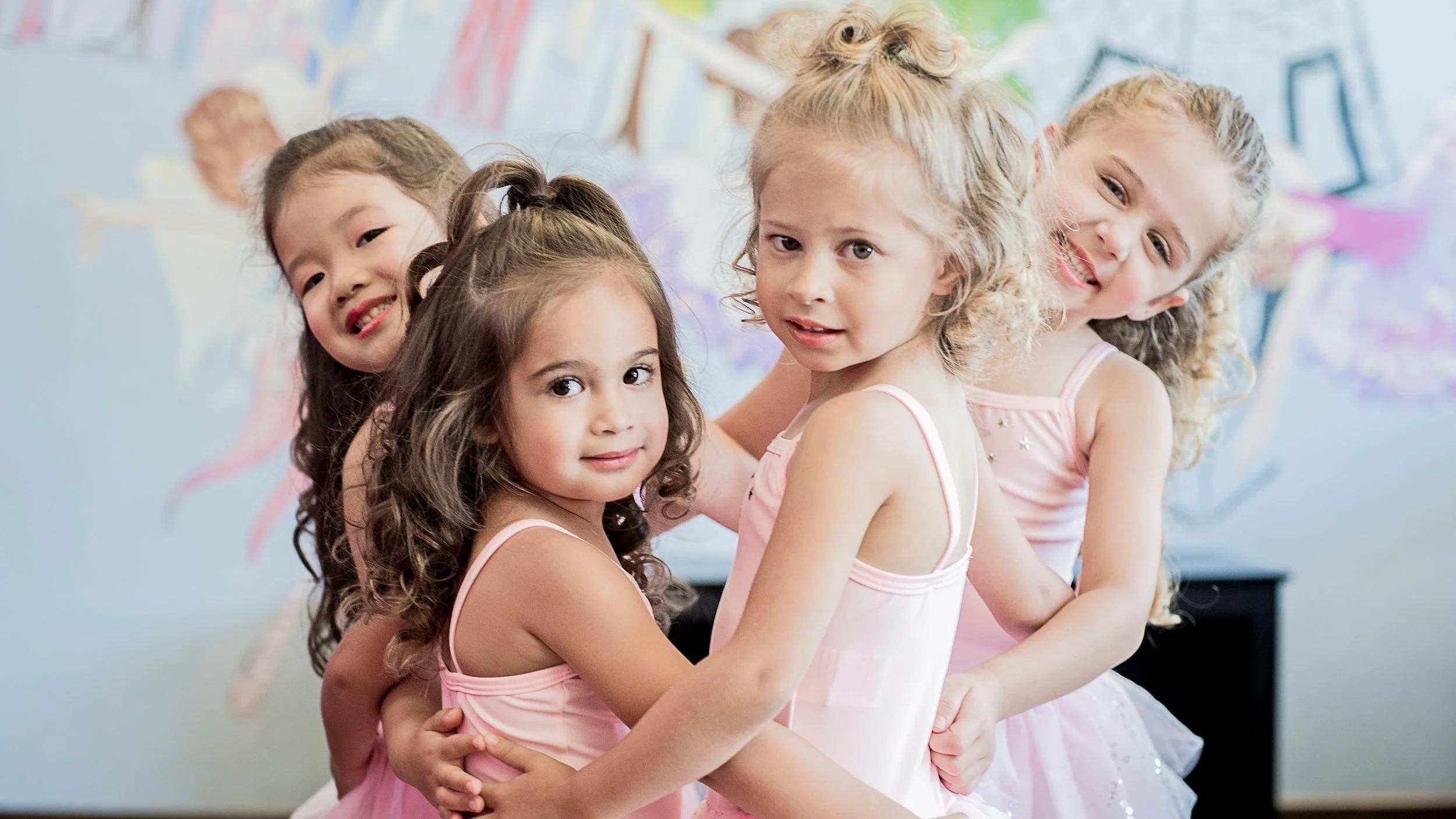 Preschool dance students participating in structured curriculum classes