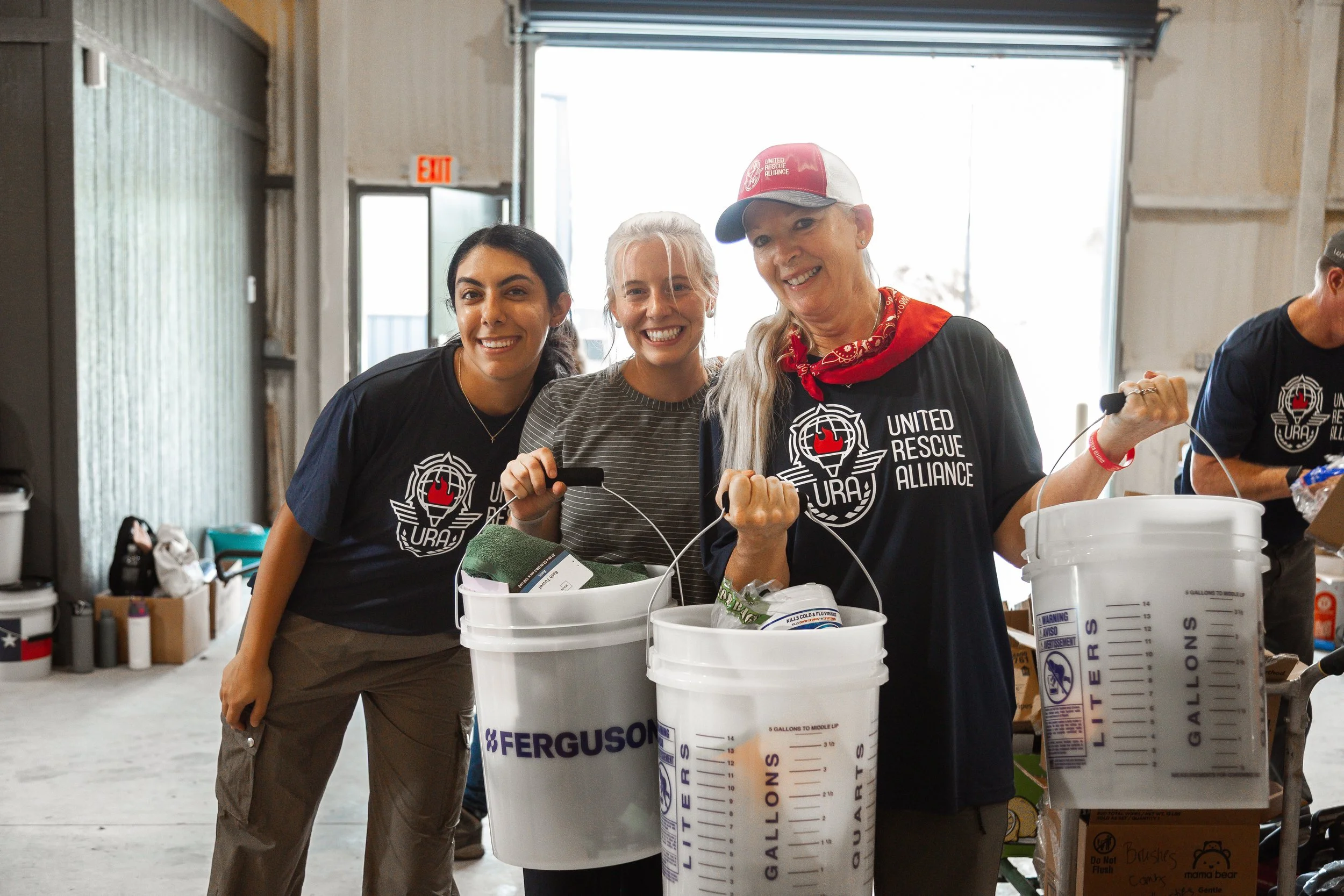 Organizing supplies at Redemption Mills Warehouse