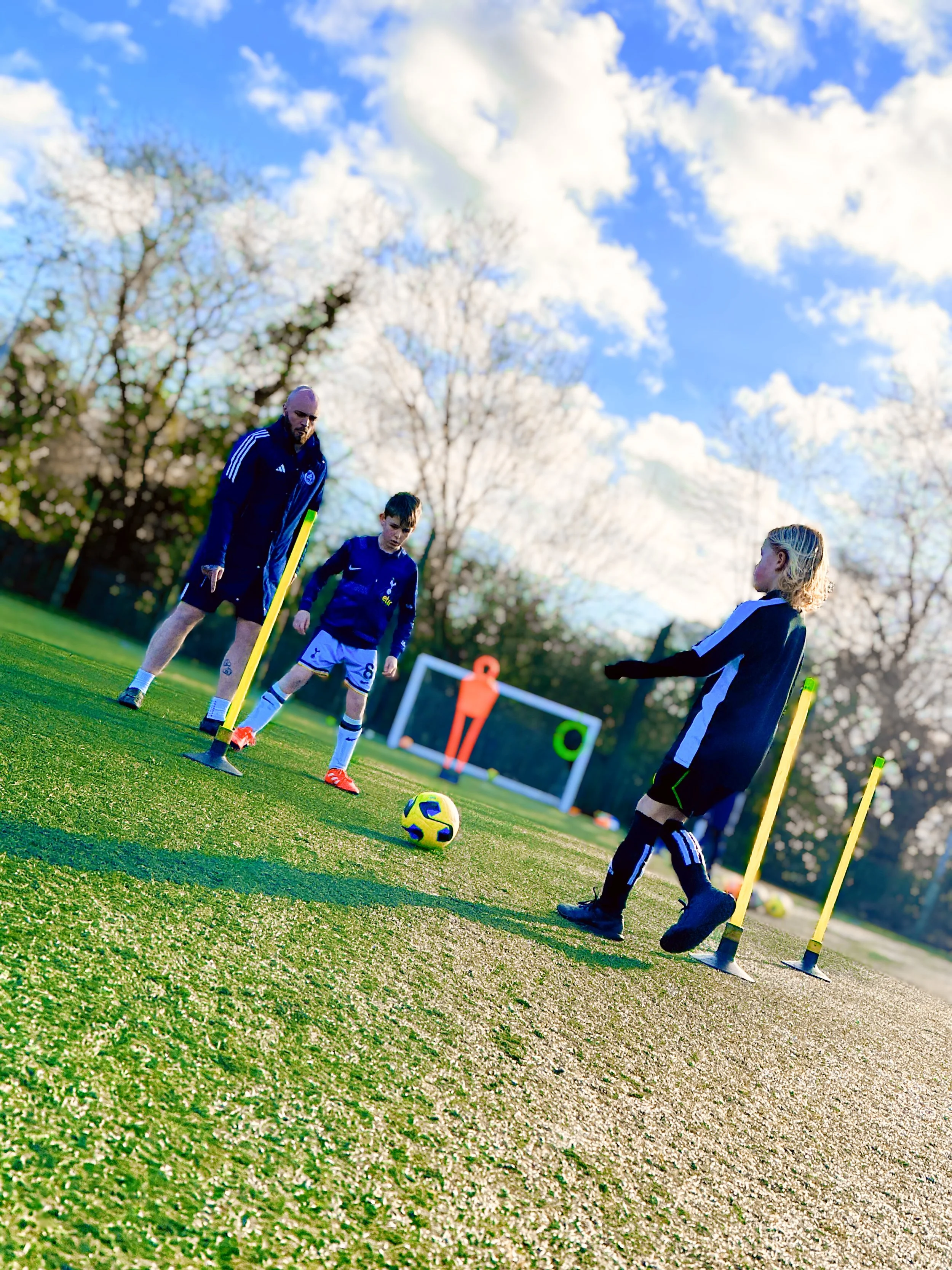 Essex Elite coach guiding players during a technical practice
