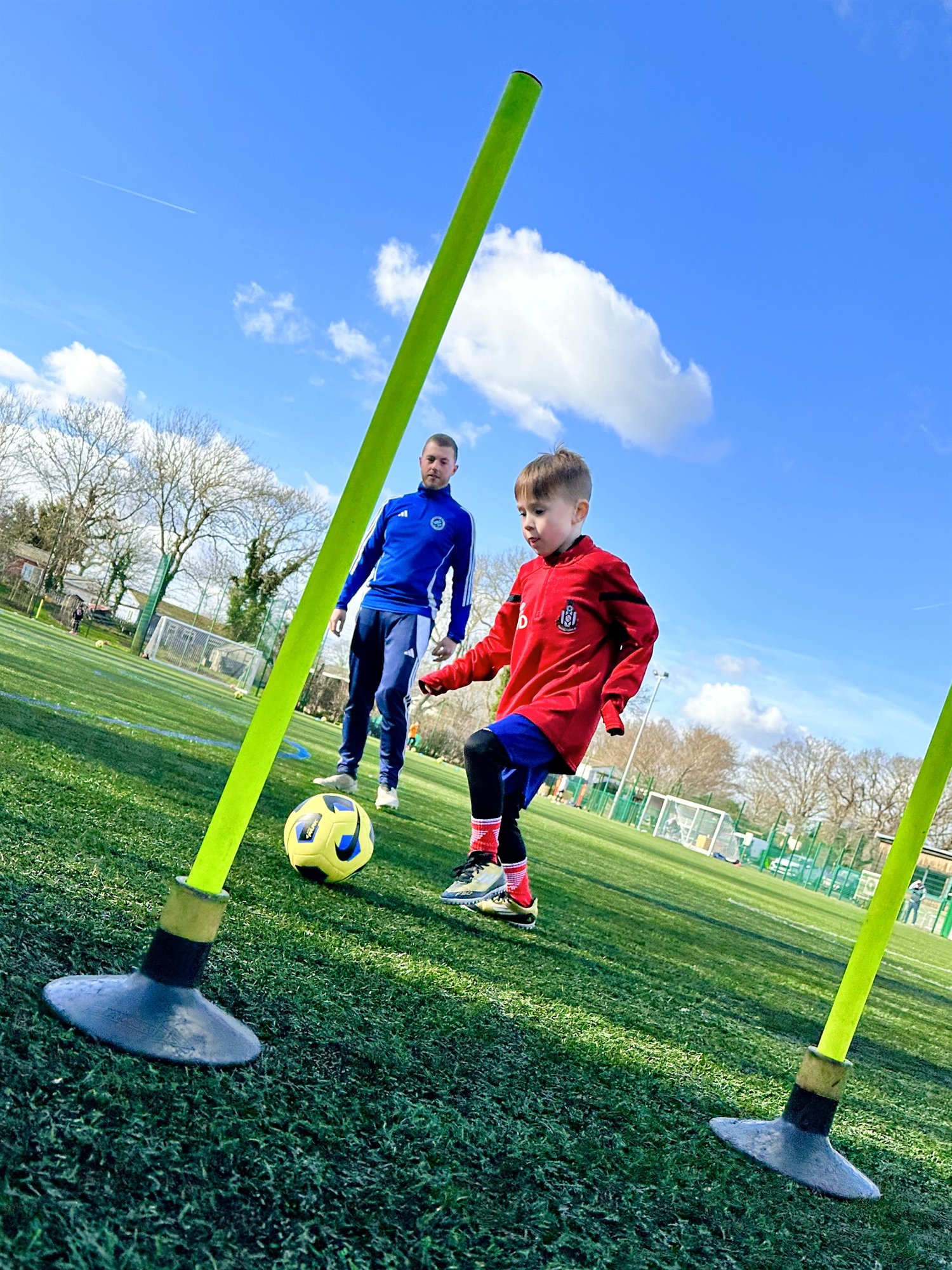 Young EEFC player developing close control with a coach
