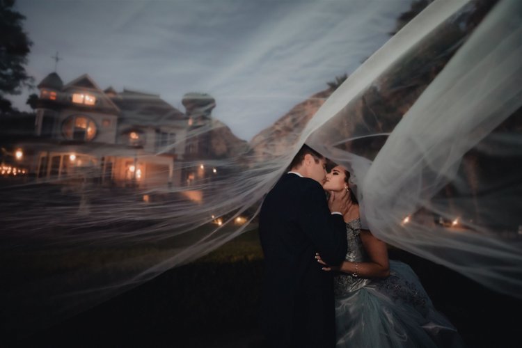 Bride and groom photographed in candlelight at Newhall Mansion