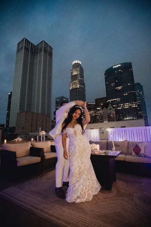 Lace with detachable off-shoulder sleeves — gown 28.2 at a Los Angeles wedding