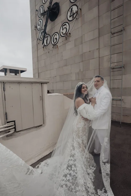 Lace with detachable off-shoulder sleeves — gown 28.1 at a Los Angeles wedding