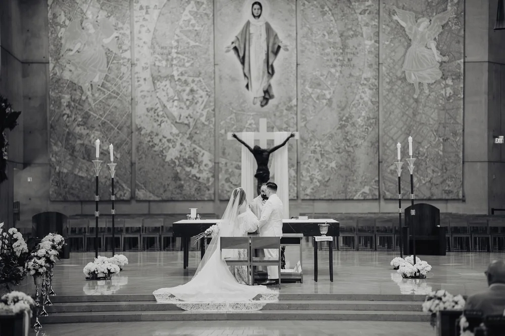 Bride and groom at the altar of the Cathedral of Our Lady of the Angels in Los Angeles
