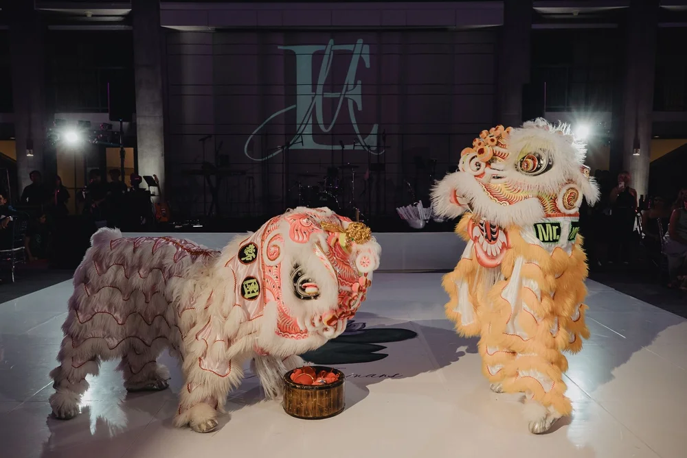 White lion beside the drum on the reception floor at a Chinese wedding