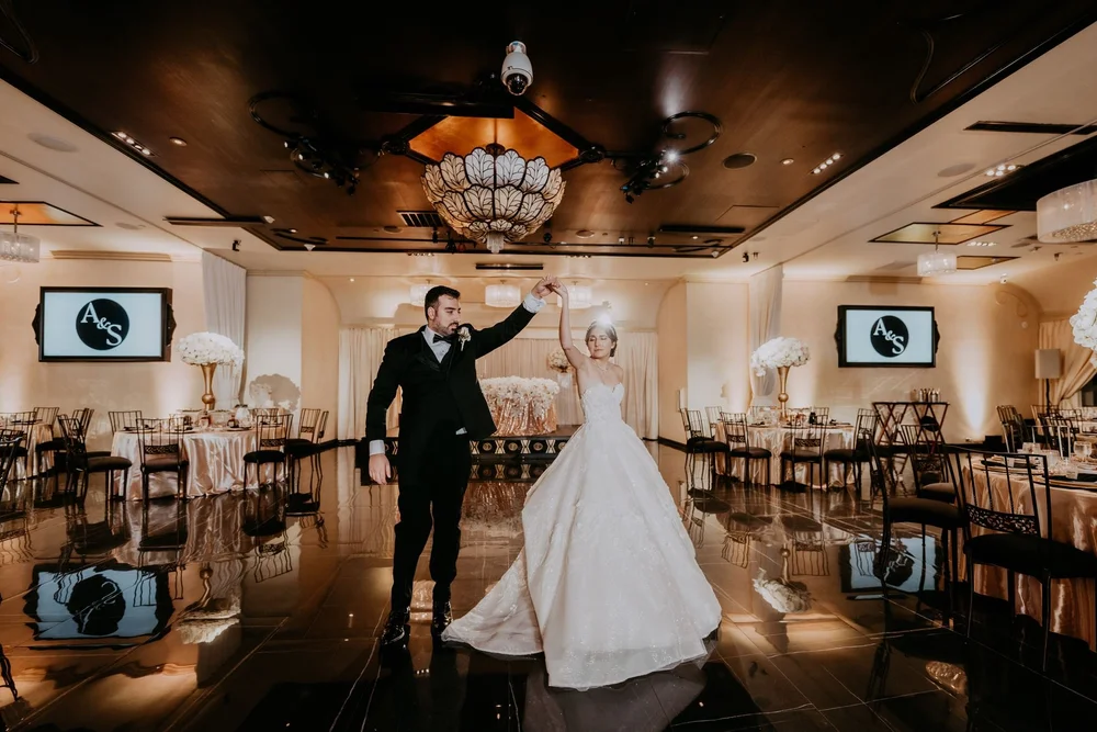 First dance under the chandeliers in the ballroom at NOOR in Pasadena