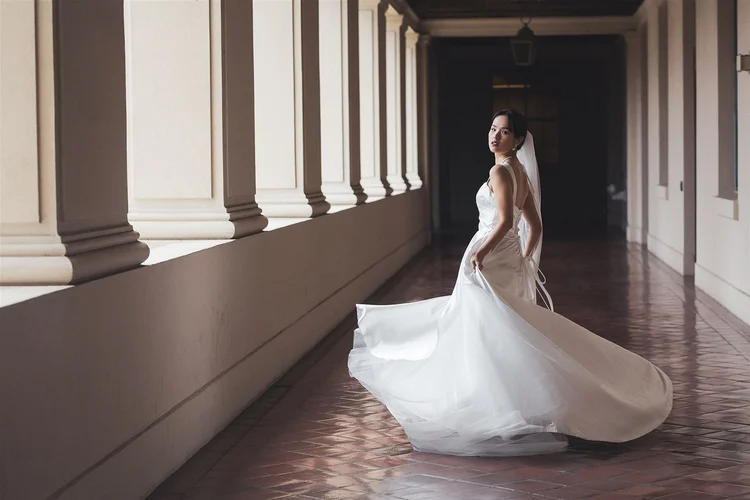 Bride in the arched colonnade at Pasadena City Hall