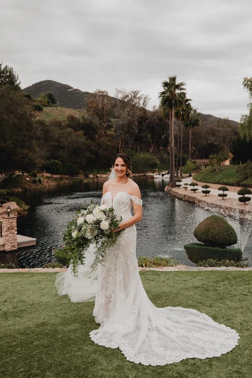 Off-the-shoulder lace fit-and-flare — gown 22.1 at a Los Angeles wedding