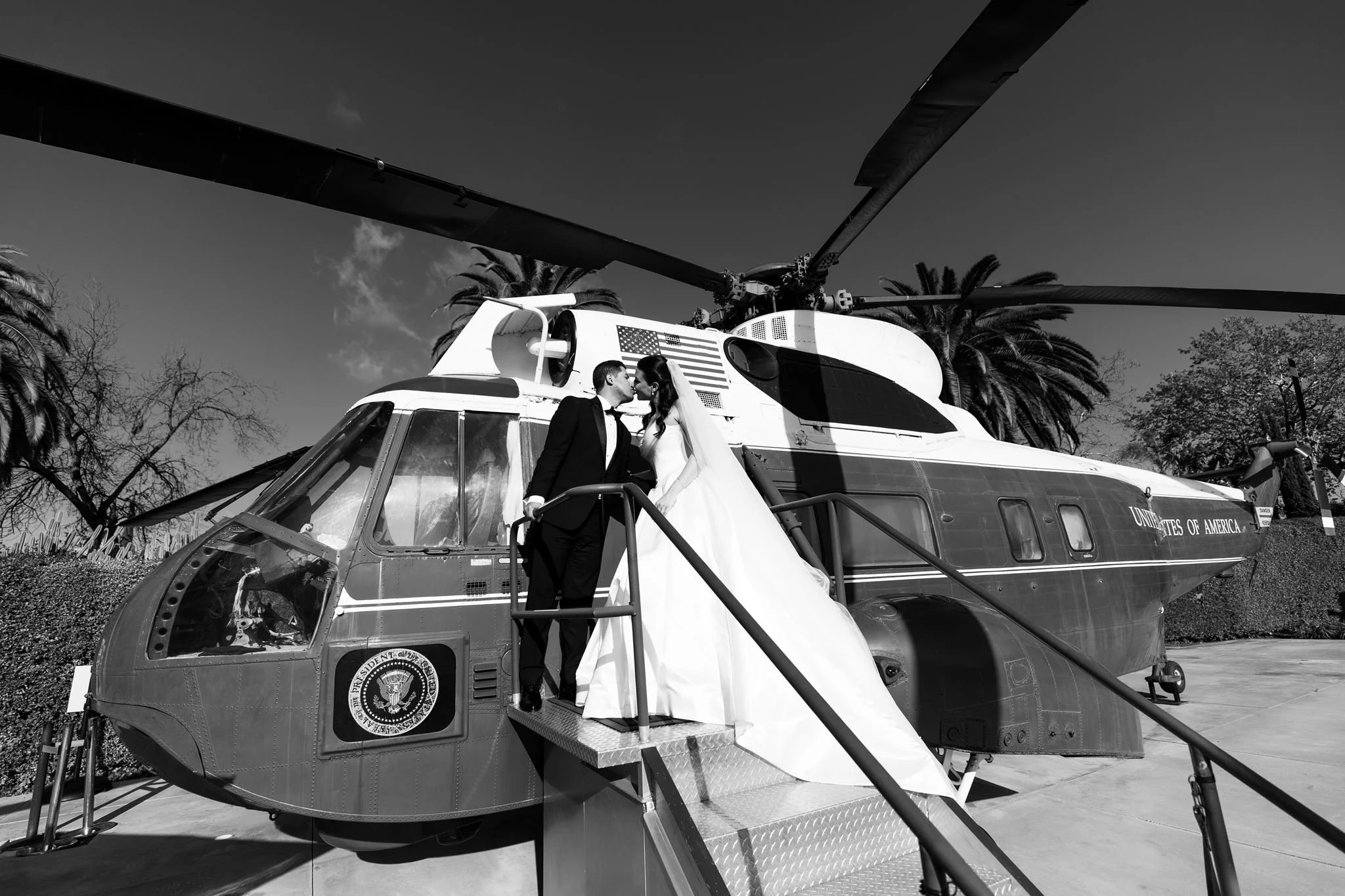 Couple on the steps of the presidential helicopter at the Nixon Library in Yorba Linda, black and white