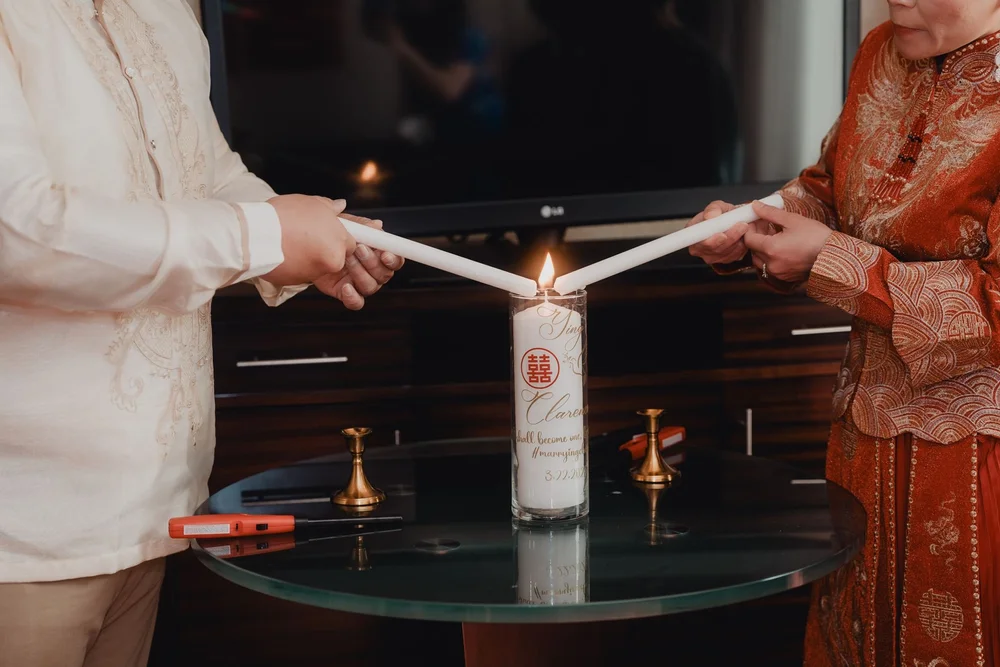 Lighting the red dragon and phoenix double-happiness candle before the tea is served