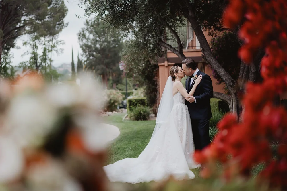 Couple embracing in the gardens at Westlake Village Inn