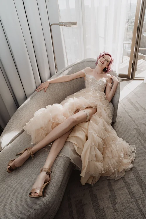 Blush ruffled gown with a high slit — gown 14.0 at a Los Angeles wedding