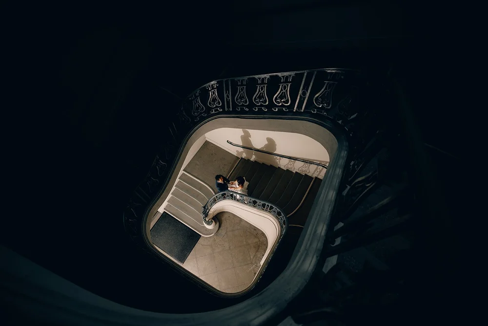 Couple seen from above in the spiral staircase at Pasadena City Hall