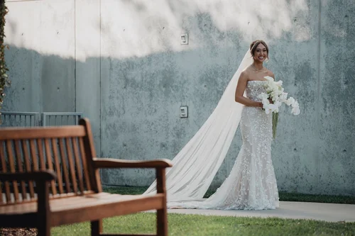 Floral fit-and-flare with a court train — gown 18.0 at a Los Angeles wedding