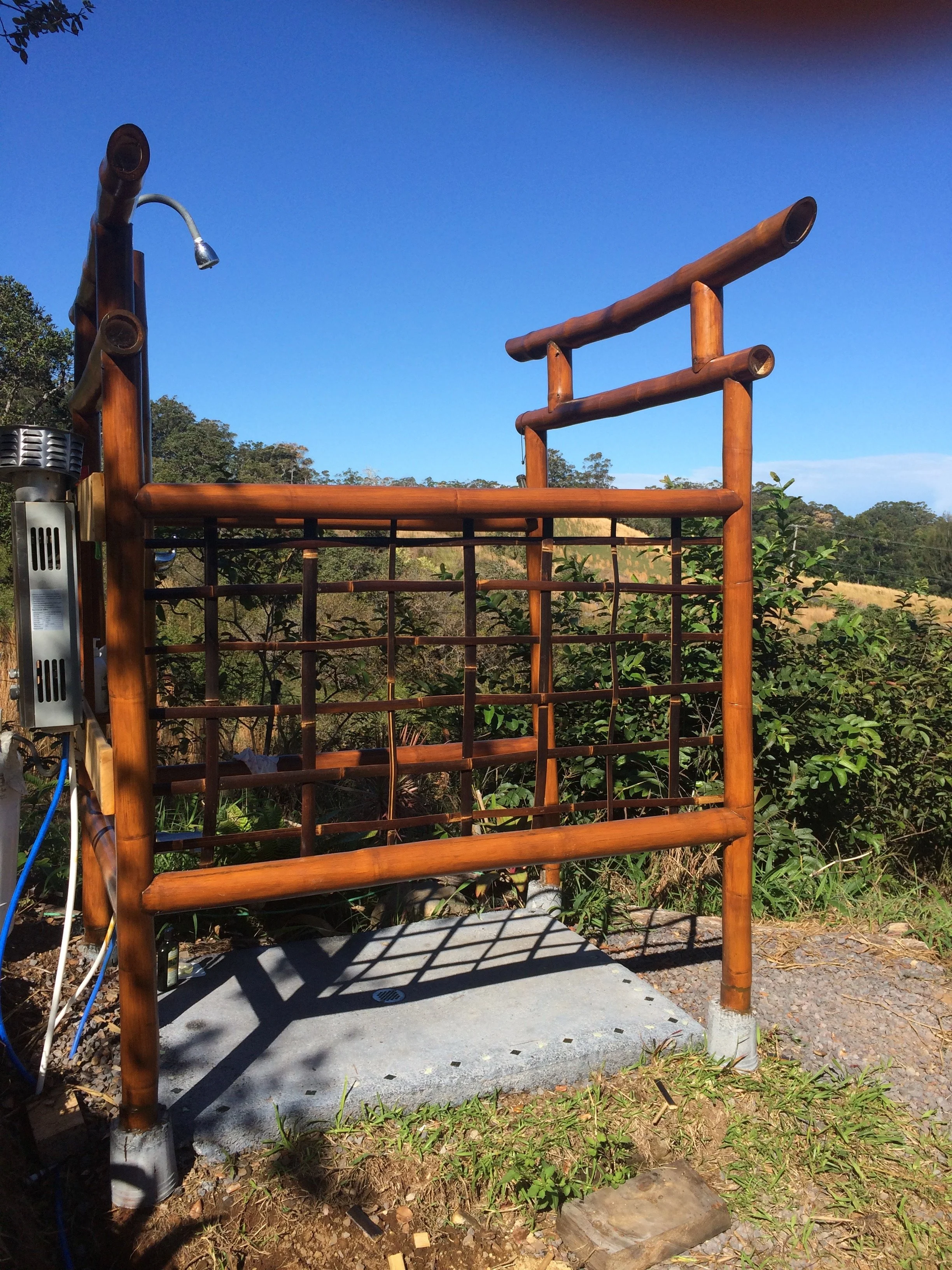 Bamboo outdoor shower torii · Big Island farm