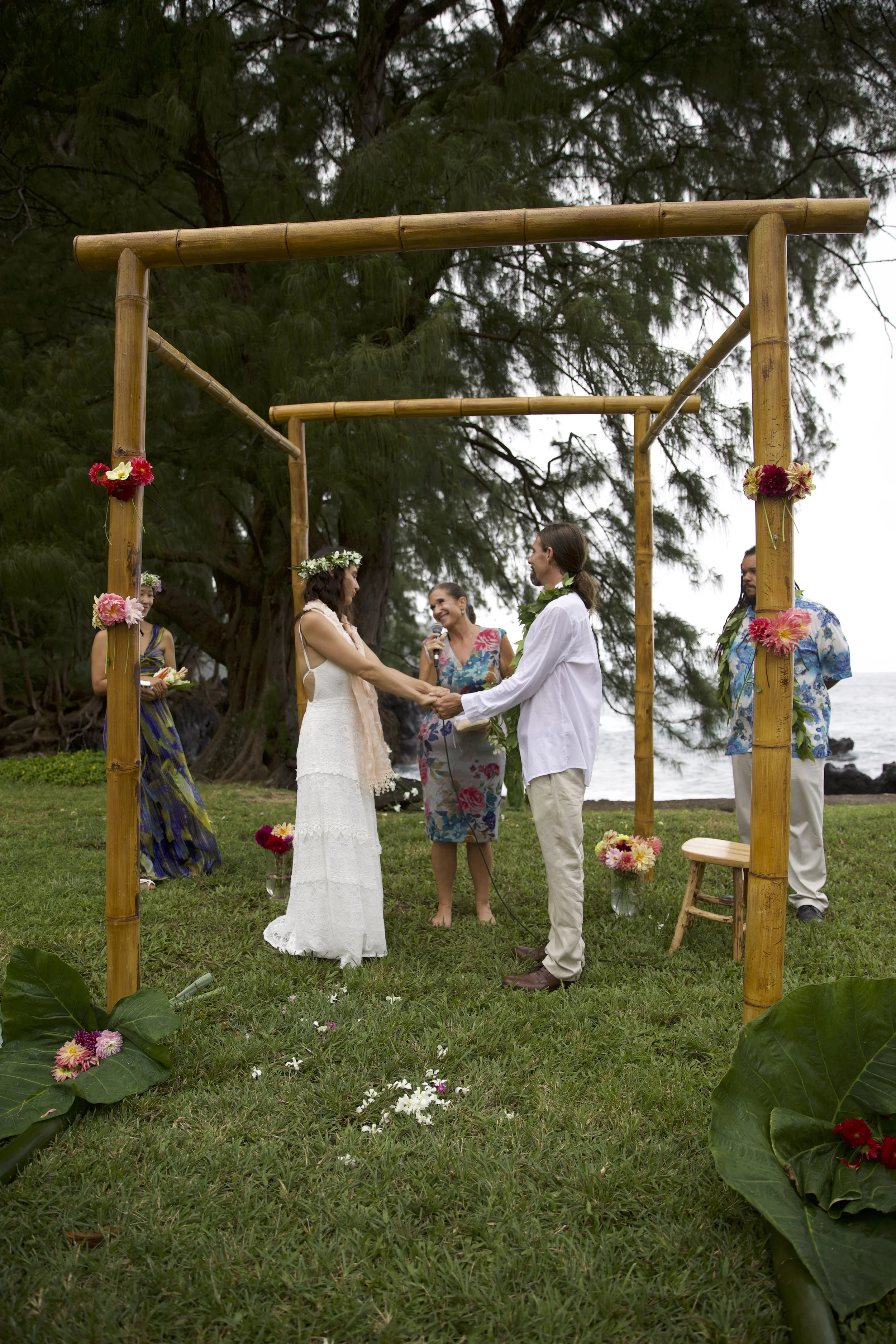 Bamboo wedding arch · beachside ceremony