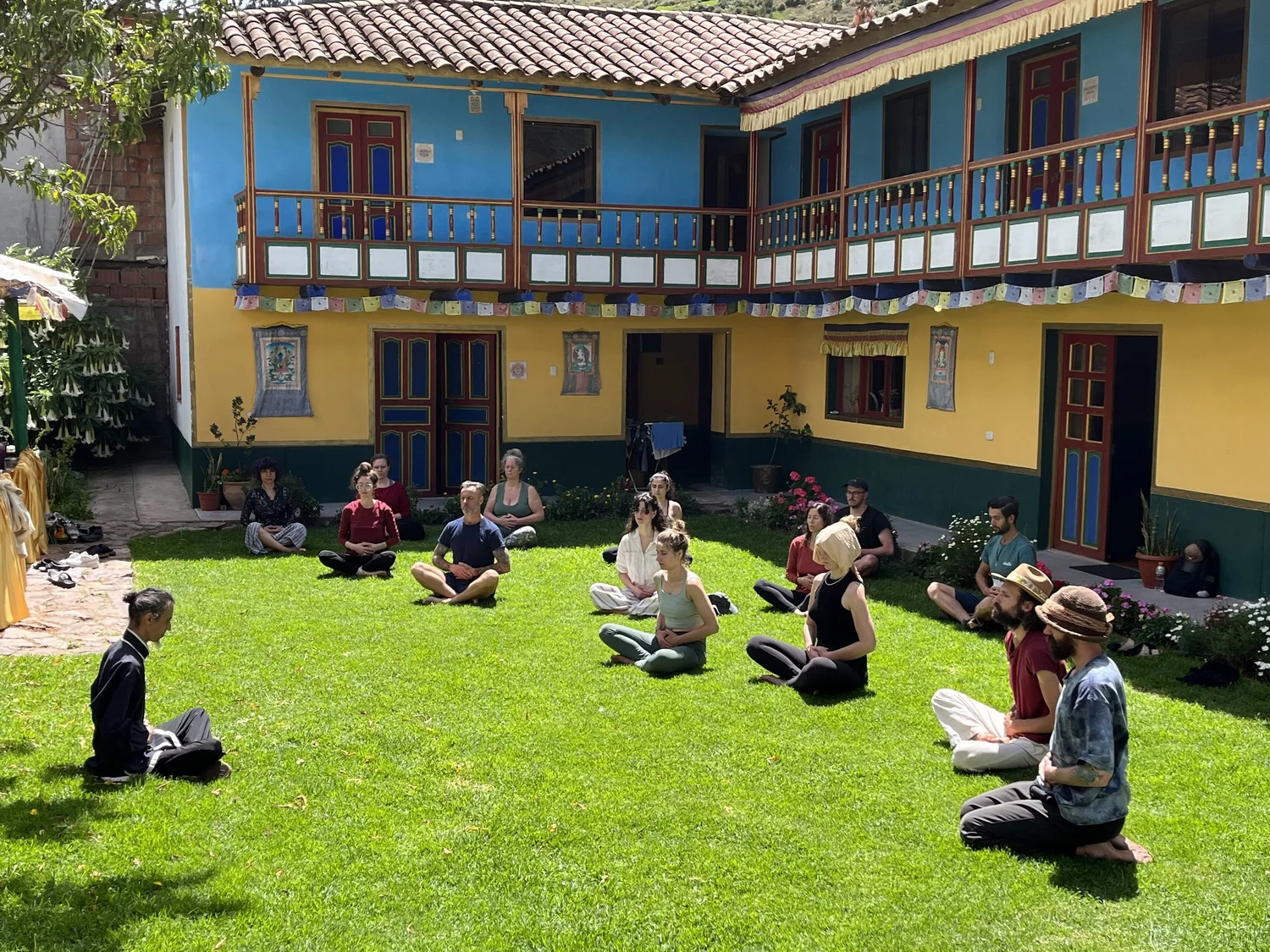 Group meditation in the courtyard at Tantraya Center