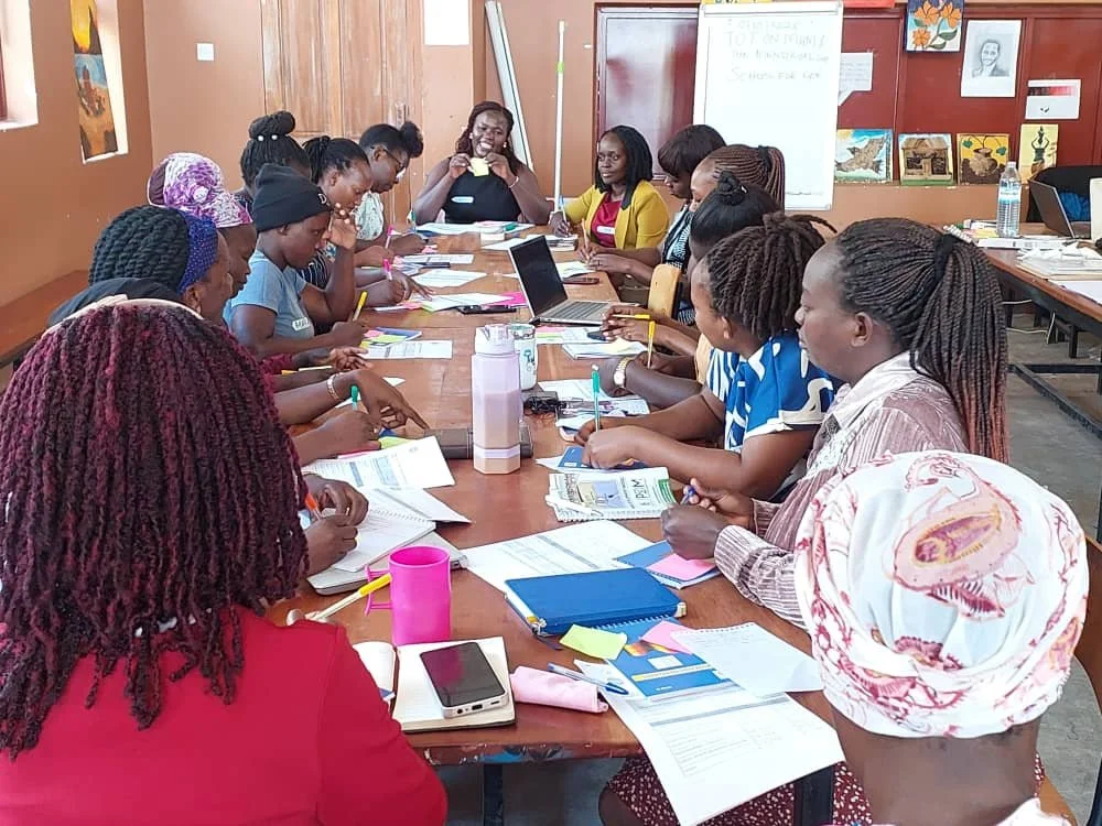 School For Life teachers in a menstrual health train-the-trainer session in Uganda
