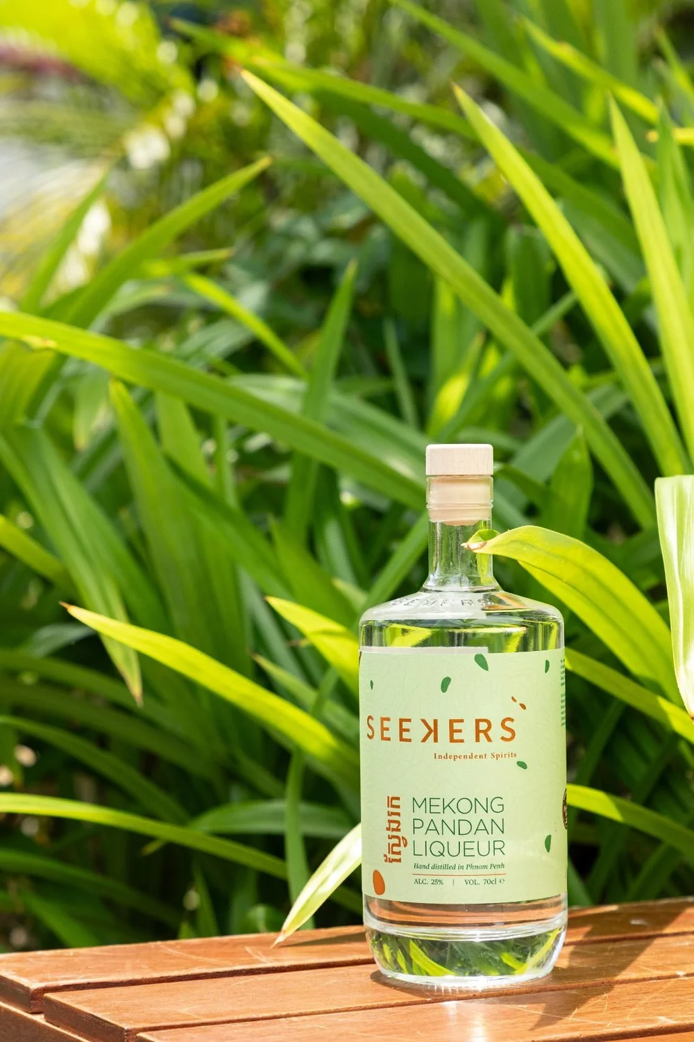 Seekers Mekong Pandan Liqueur bottle among pandan leaves