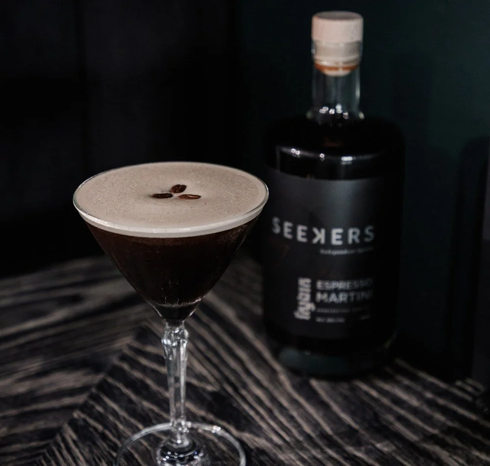 Seekers Espresso Martini ready to serve bottle with a poured martini and three coffee beans