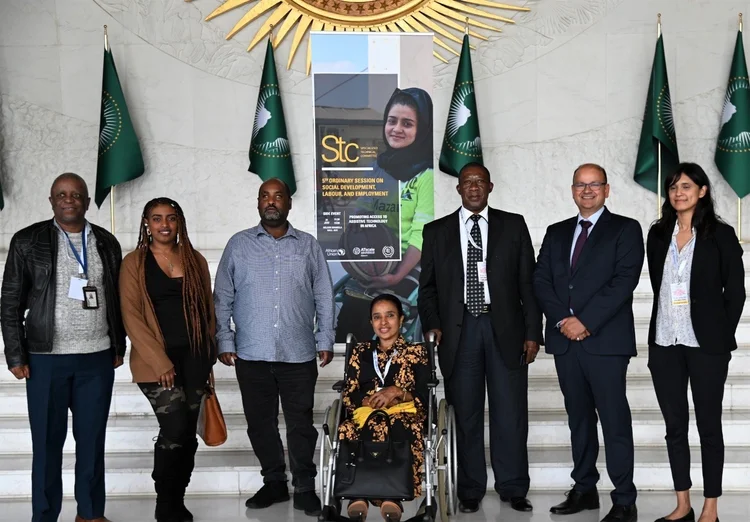 A group photo of seven speakers Standing behind ATscale banner.  Lefhoko Kesamang, Senior Social Welfare Officer, African Union Commission (first from left) Mr. Musie Tilahun Yirga, Executive Director, Ethiopian Lawyers with Disabilities Association 