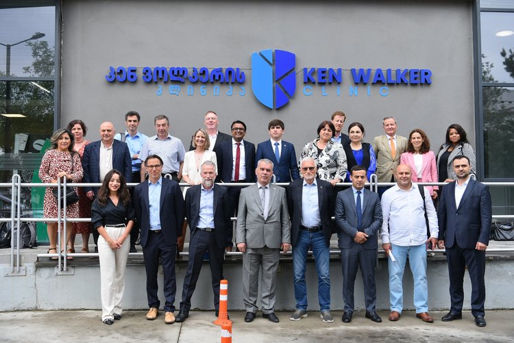 ATscale Board members stand in front of the Ken Walker Clinic in Tbilisi