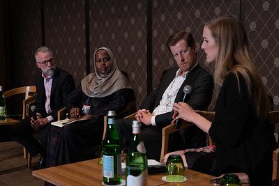 Pascal Bijleveld, Dr. Zeinab Gura, Kristoffer Gandrup-Marino and Catherine Cheney (moderator) sitting in a line during the panel discussion at Devex CheckUp