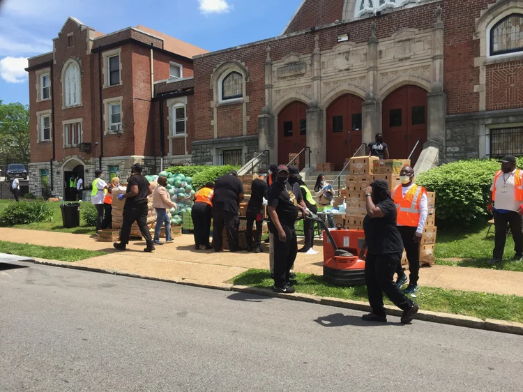 Volunteers distributing food outside St. Paul AME Church during the COVID-19 pandemic