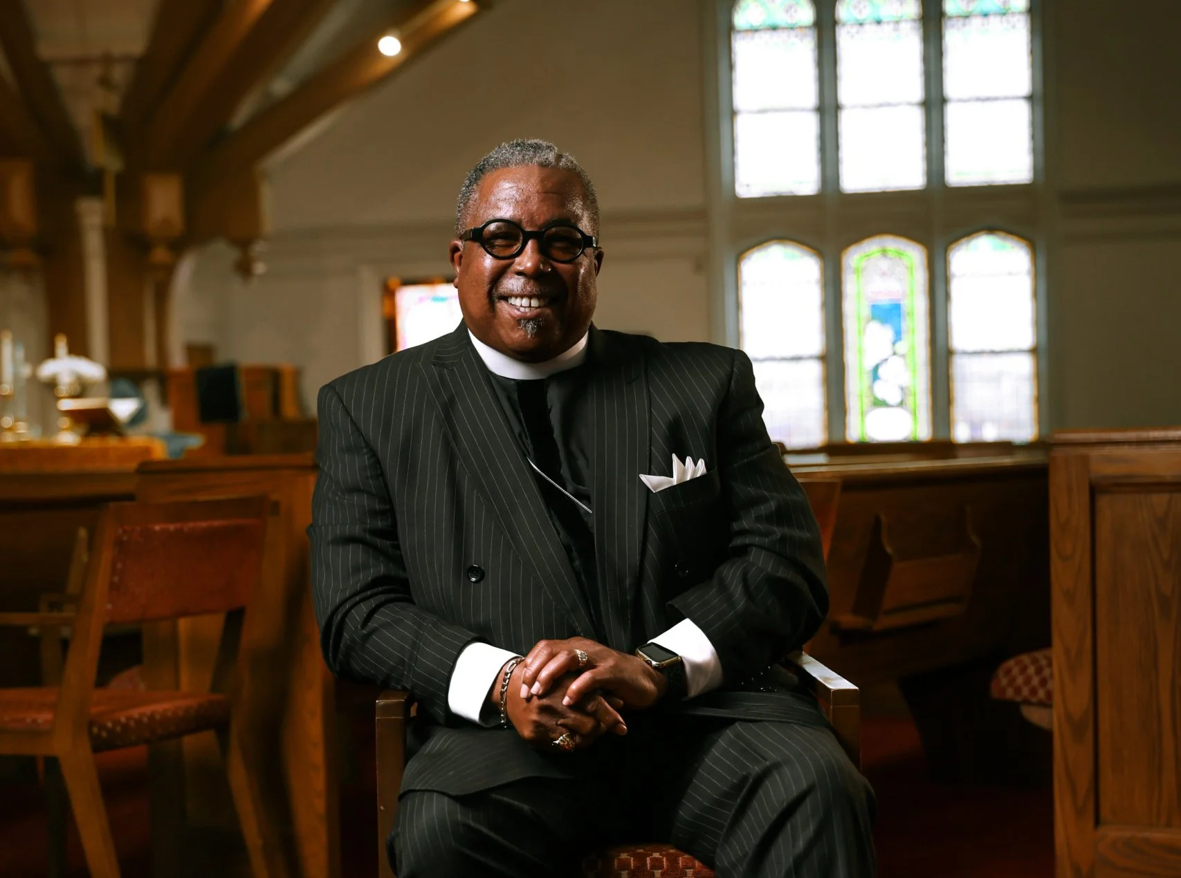 Pastor Booker seated in the sanctuary at St. Paul AME Church