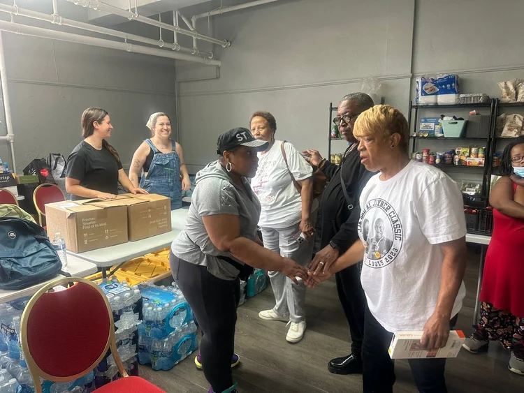 Community members supporting tornado relief at St. Paul on the same day as the Healing the City display