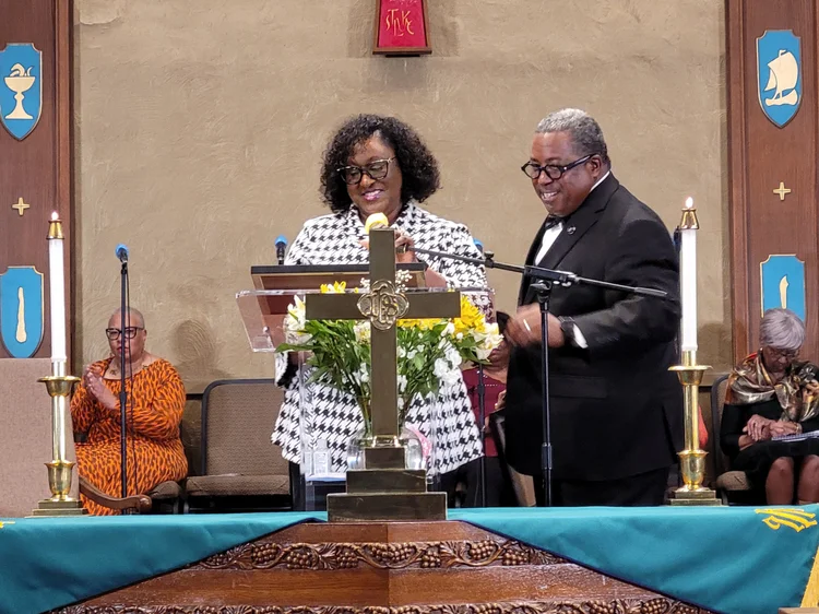 Lady Gail Booker and Pastor Booker together at the sanctuary pulpit