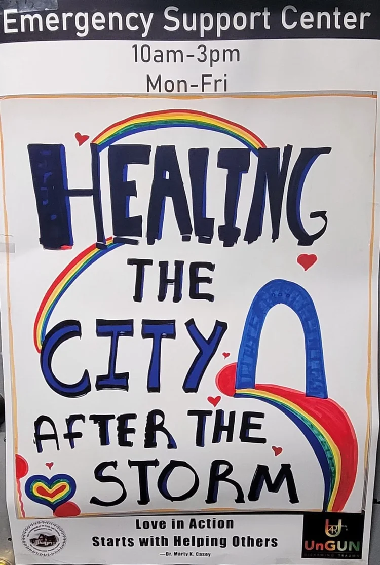 Emergency Support Center sign reading Healing the City After the Storm