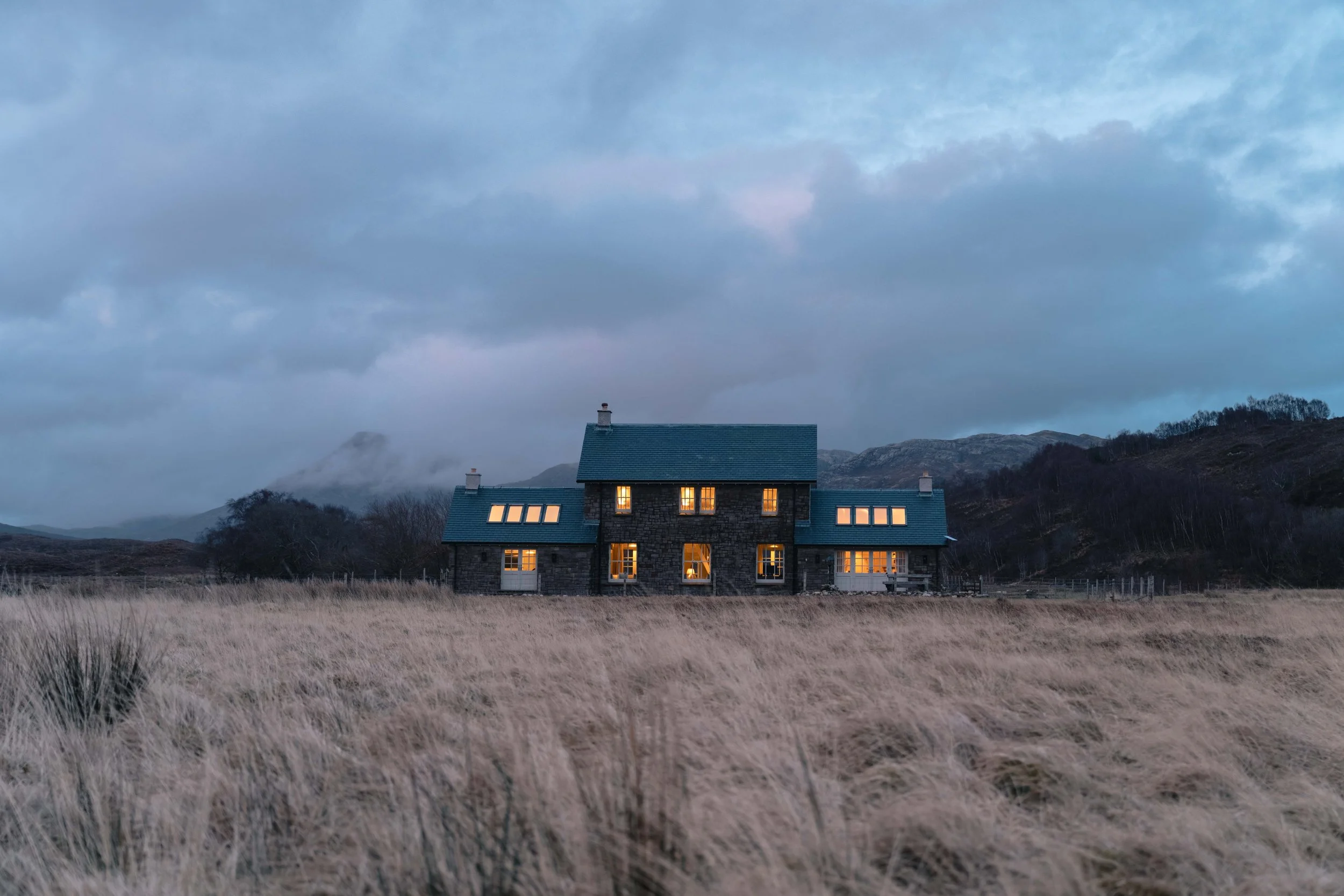Highland landscape with loch and self-catering property