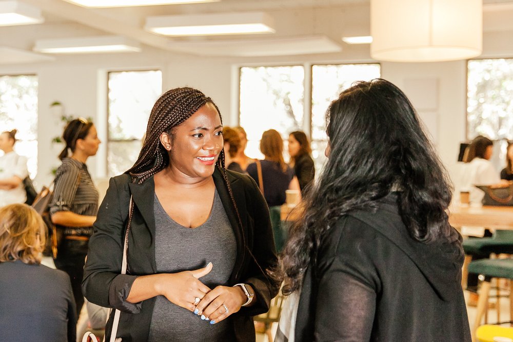 Two women talking at a Beyond Coffee event