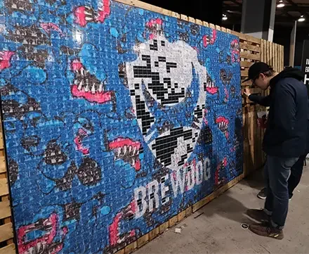 Social Mosaic activation hire Aberdeen — guests contributing to a branded collaborative mosaic at a BrewDog event by Social Jungle