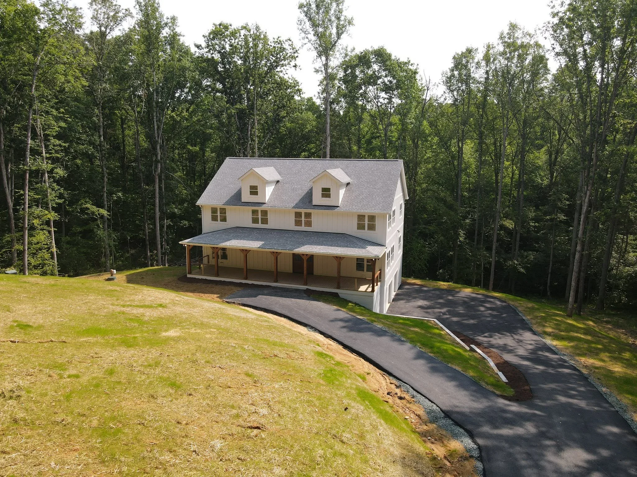 Huezos Construction Custom Home 3 Story Exterior on Basement and Wooded Lot, financed by BuildBuyRefi.com