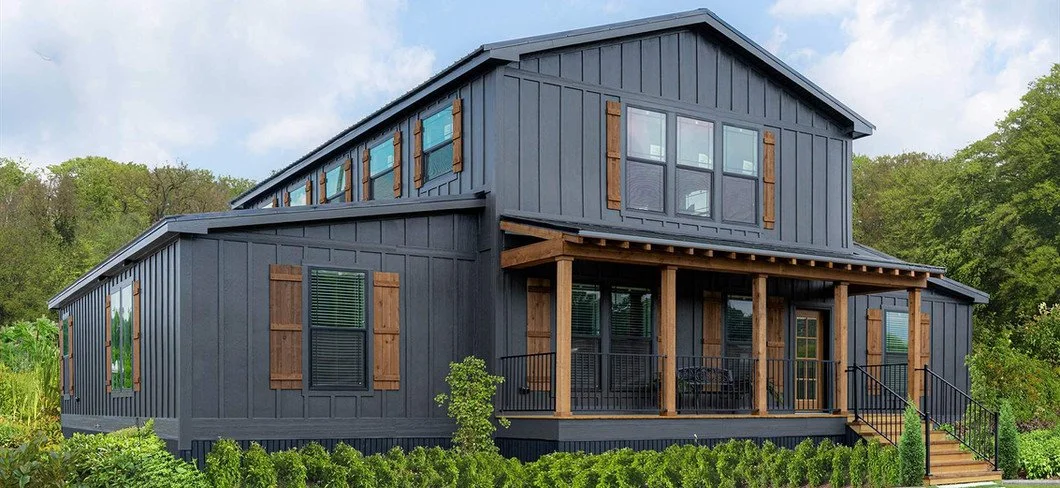 The Barndominium DVHBSS-6604-1 modular barndominium dark exterior at Texas Built Mobile Homes, financed by BuildBuyRefi.com