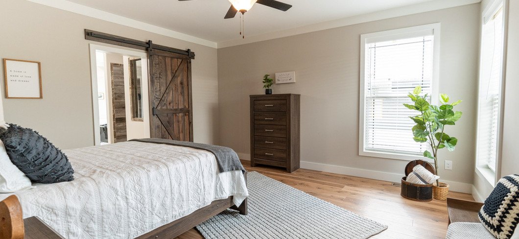 The Barndominium DVHBSS-6604-1 primary bedroom ensuite bathroom, financed by BuildBuyRefi Home Loans