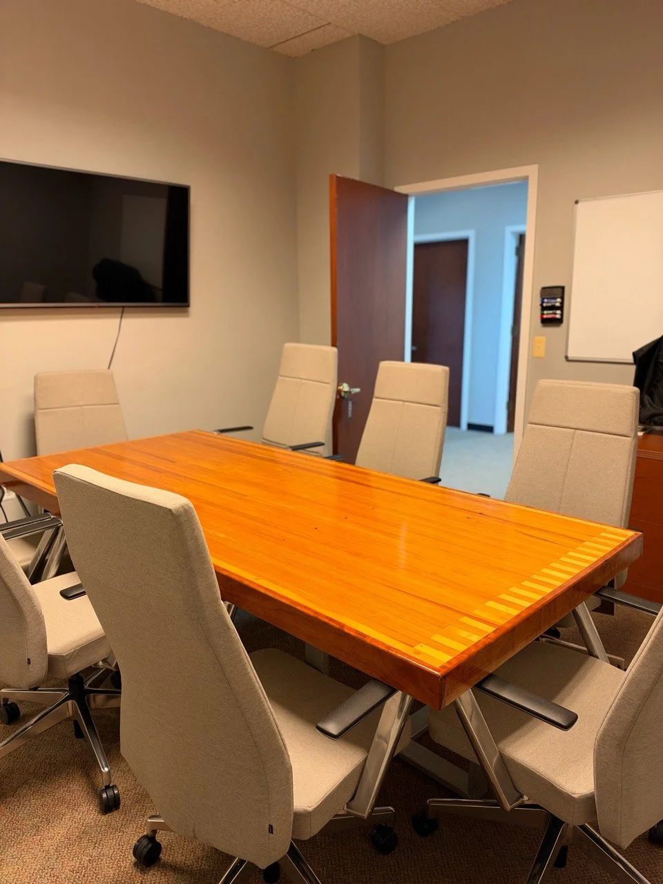 Propeller meeting room with a conference table and display