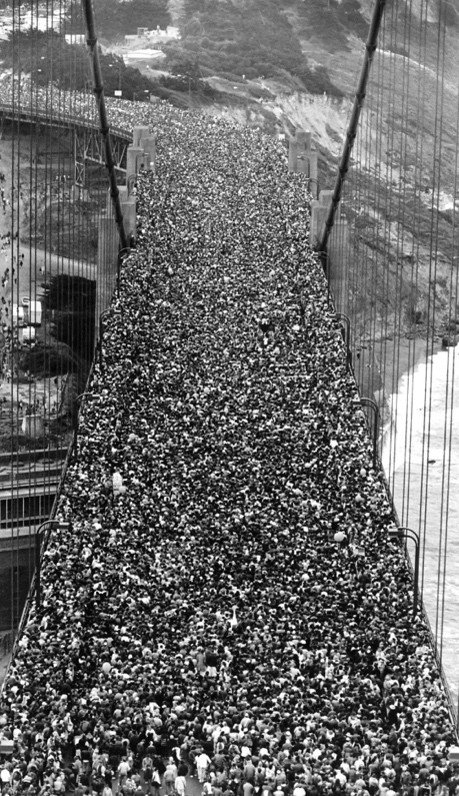A large crowd crossing the Golden Gate Bridge during its 50th anniversary celebration in 1987.
