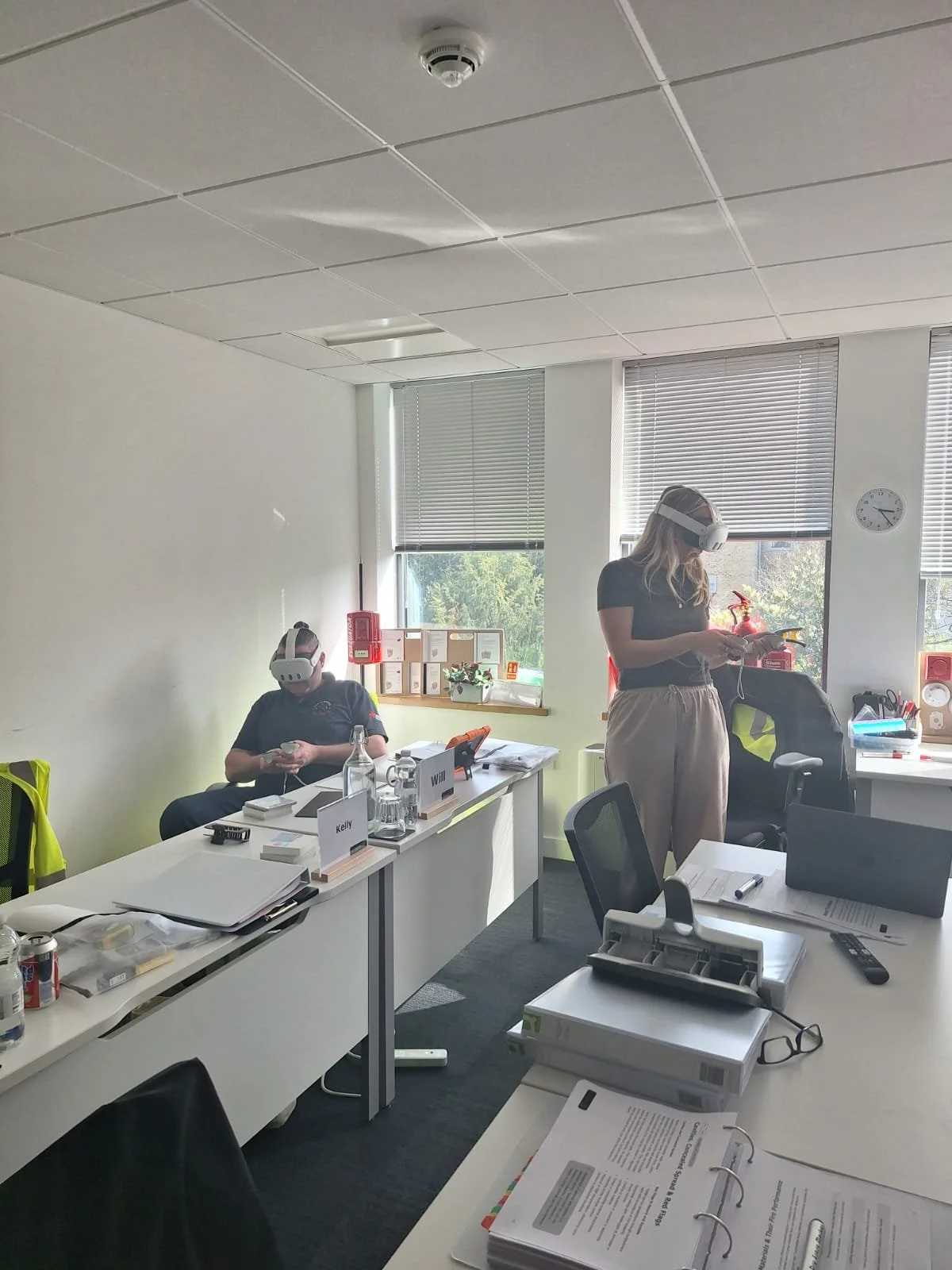 Two learners taking part in virtual reality fire safety training