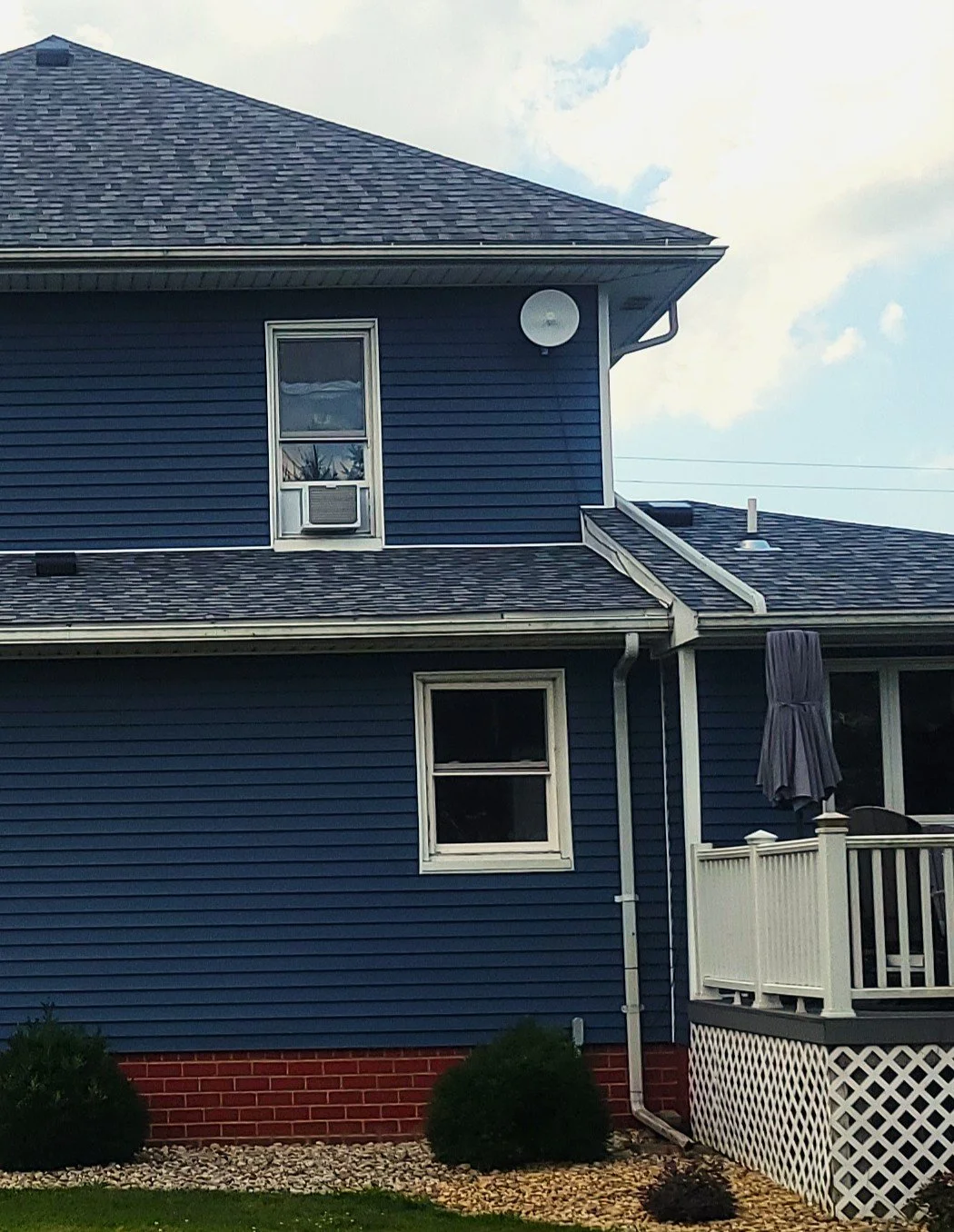 Small DerbyNet receiver mounted under the eave of a customer home