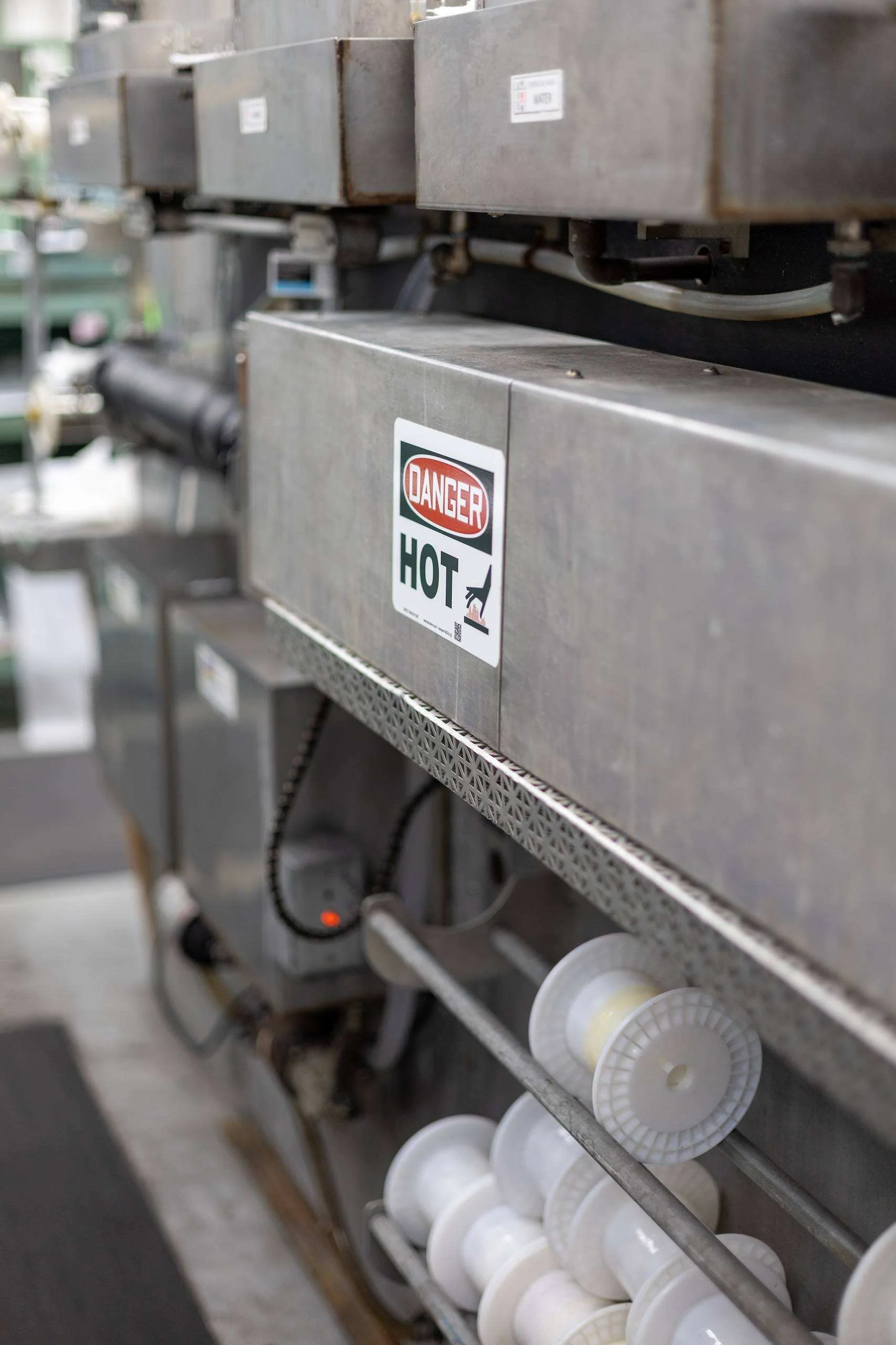 Continuous annealing line with ceramic spools of fine wire feeding through heated chambers