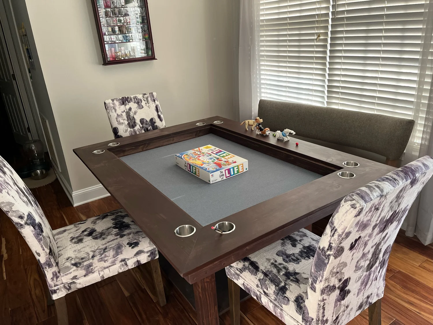Custom game table with a dark playing surface set up in a dining room