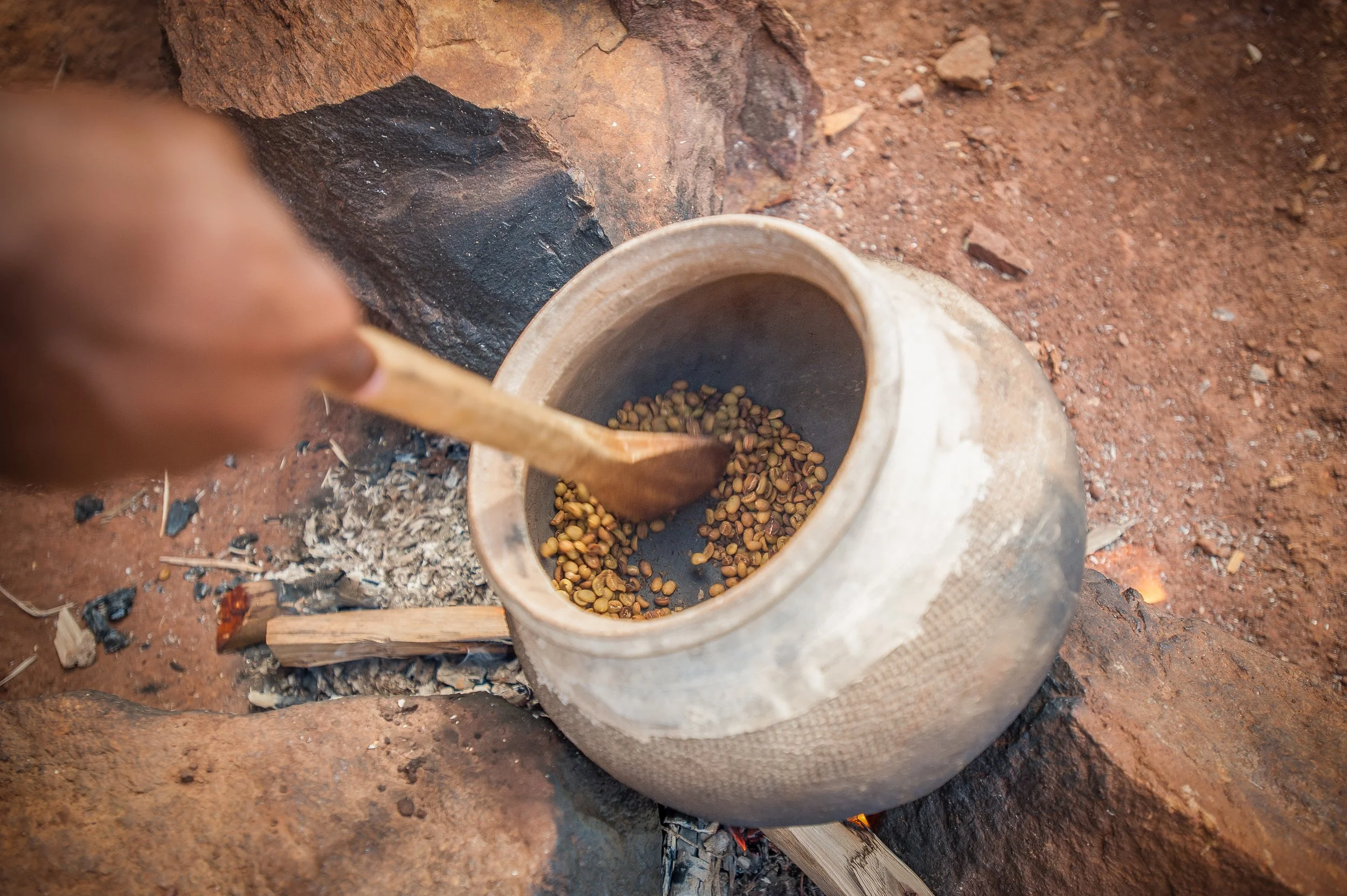 Placeholder photo — traditional home roasting in a clay pot