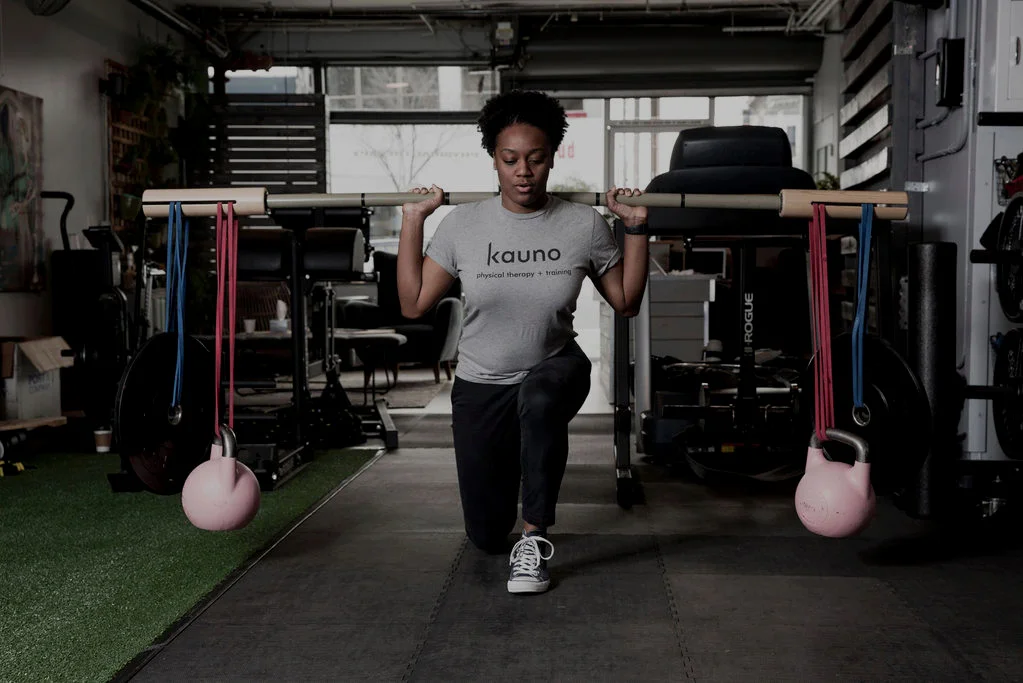 Coached kettlebell work on the gym floor